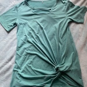 green over sized shirt with knot.